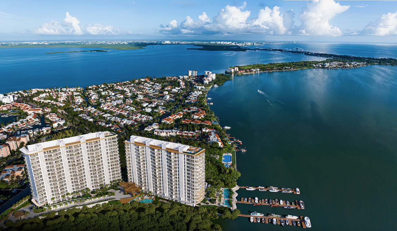One Laguna twin towers aerial view with marina and Nichupté Lagoon